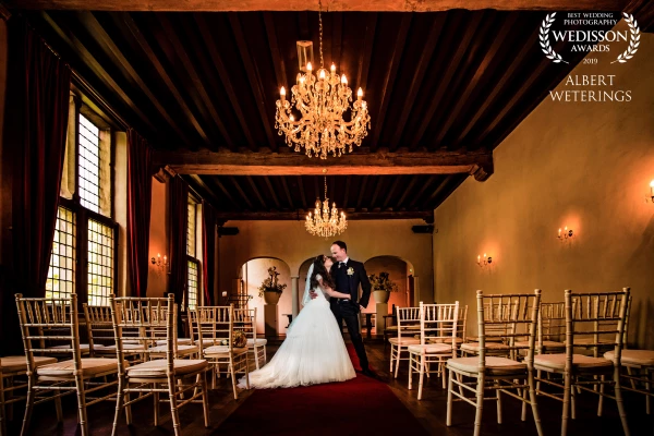 The couple got married in the old Castle in Dussen (the Netherlands)  After the ceremony I wanted to make use of the two chandeliers in the room. When everybody left the room, I made this picture using one of the camera flashes.<br />
Check our website blog for some more pictures of that great wedding day!